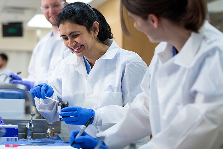 Mayo Clinic researchers preparing specimens in a laboratory