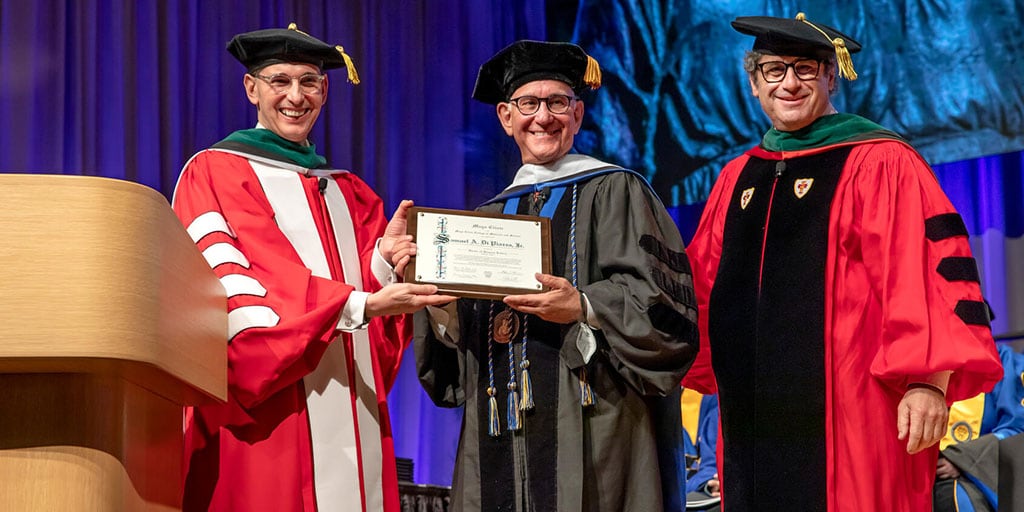 Sam Di Piazza receives recognition as an honorary degree recipient.