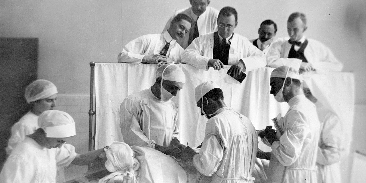 Historical photo of visiting surgeons observing at Mayo Clinic