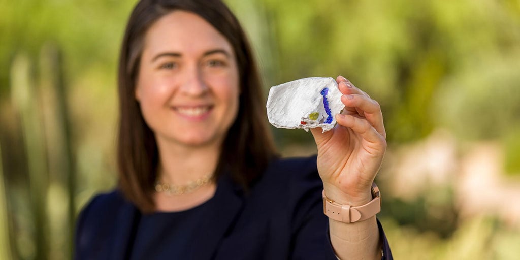 Michelle Higgins, Ph.D., holding her 3D printing project