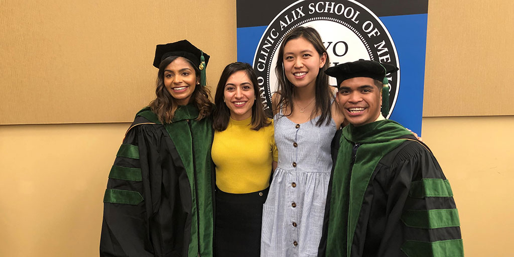 Nazanin Yeganeh Kazemi (second from left) at the 2019 graduation of her 2015 M.D. class at Mayo Clinic Alix School of Medicine