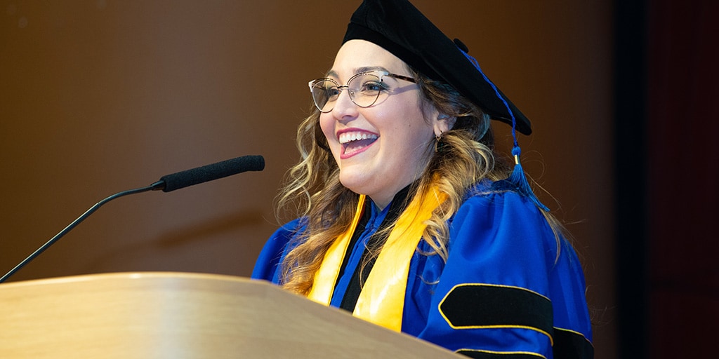 Luz Milbeth Cumba Garcia, student speaker from Mayo Clinic Graduate School of Biomedical Sciences, speaks at 2022 Commencement