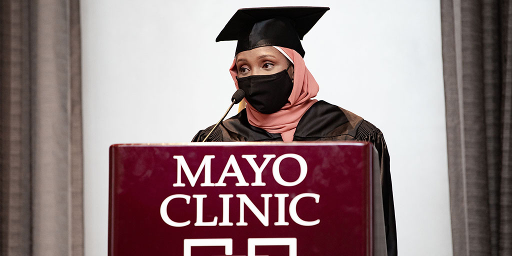 Naima Mohamed speaker to her fellow classmates at the 2022 Physician Assistant program graduation ceremony