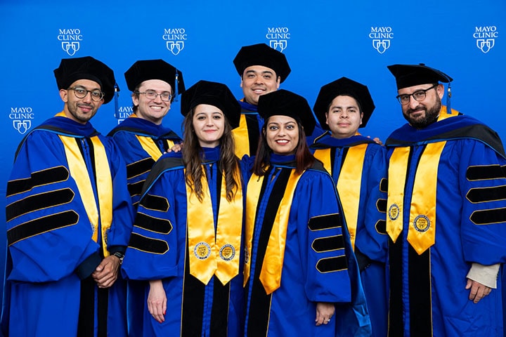 A group of graduates from Mayo Clinic pose for a picture at the 2023 commencement ceremony in Rochester