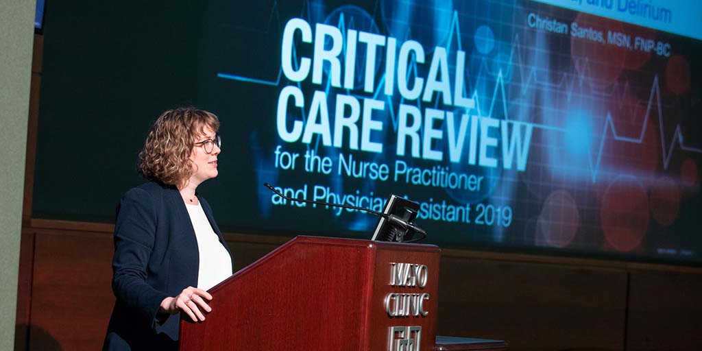 Christan Santos, APRN, speaking at a Critical Care Review event