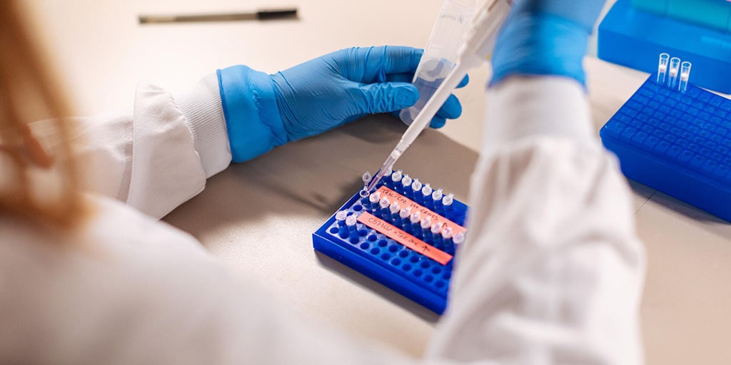 Researcher working with a pipette in the lab at Mayo Clinic