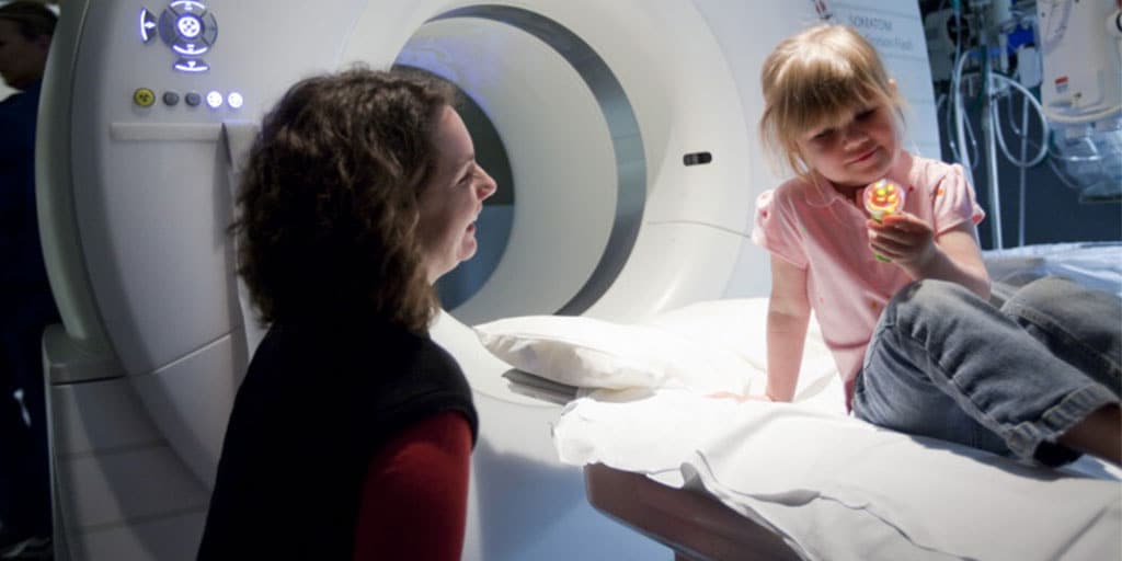 Child life specialist working with child during hospital visit.