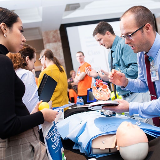 Mayo Clinic faculty member and prospective students at an open house event