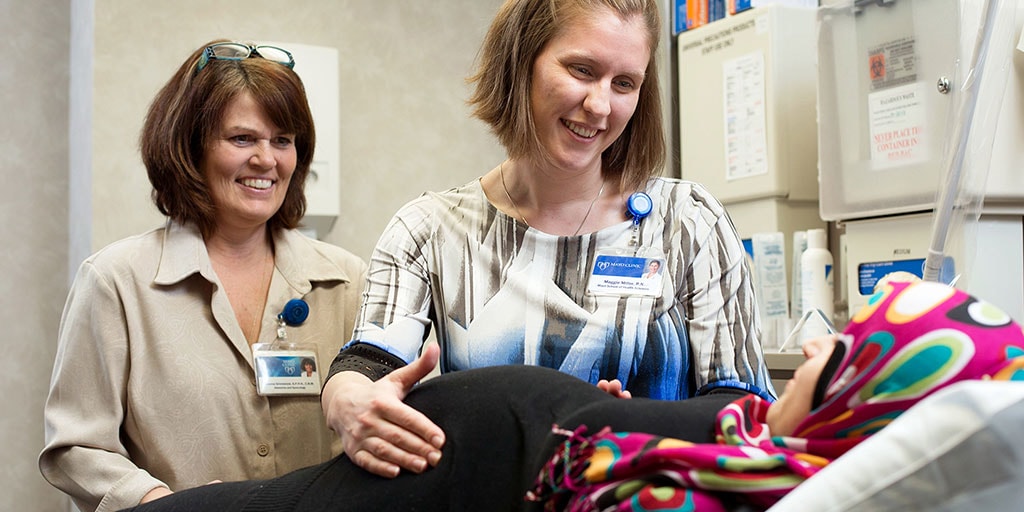 Mayo Clinic nurse midwives examining a pregnant patient