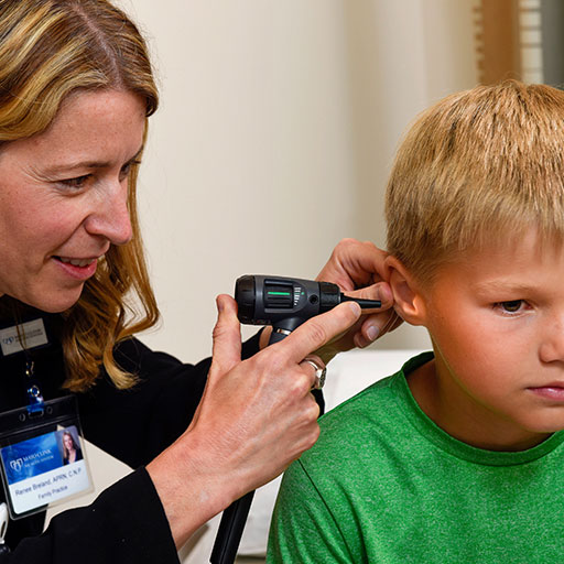 Mayo Clinic nurse practitioner examining a young patient