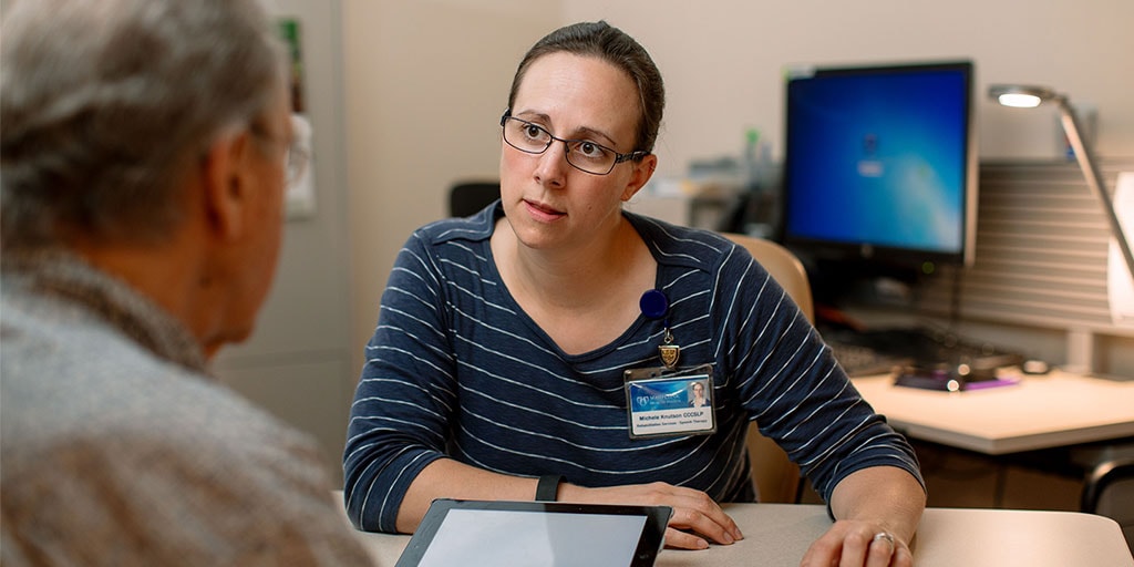 Mayo Clinic medical speech language pathologist listening to a patient