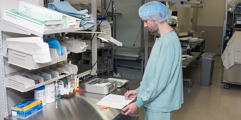 A Mayo Clinic central service technician preparing supplies