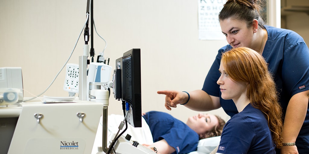A student in the clinical neurophysiology program reviewing test results