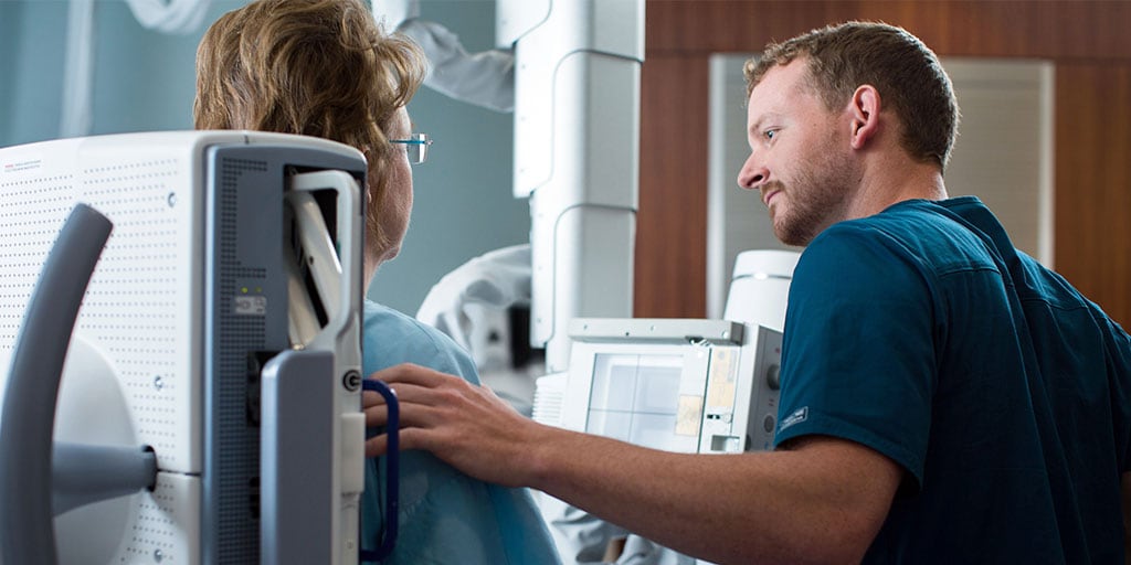 Mayo Clinic radiography student performing a scan on a patient