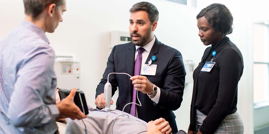 A physician and fellows examine a patient at Mayo Clinic