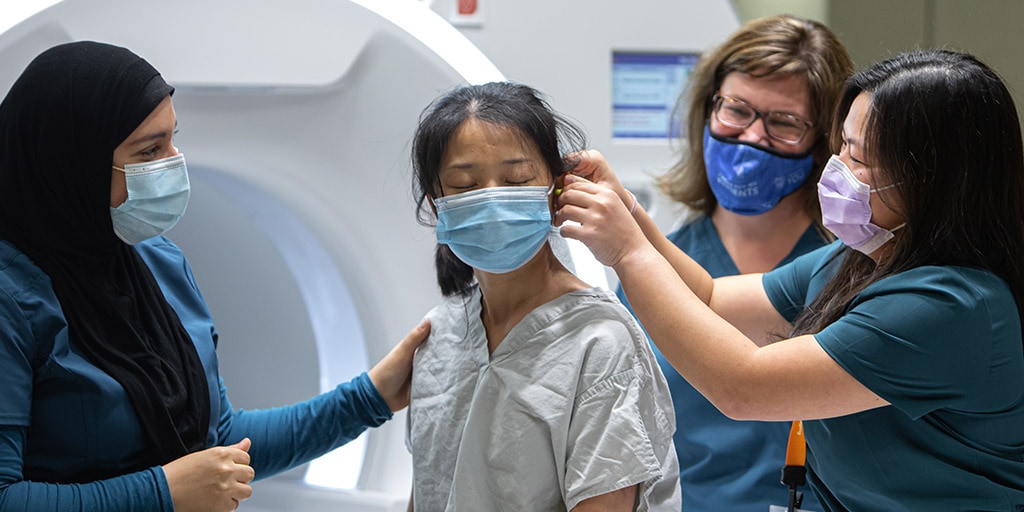 Nourhan Halawa and Quyen Nguyen are instructed by Jennifer Myers in Magnetic Resonance Imaging (MRI) techniques at Mayo Clinic in Rochester, Minnesota.