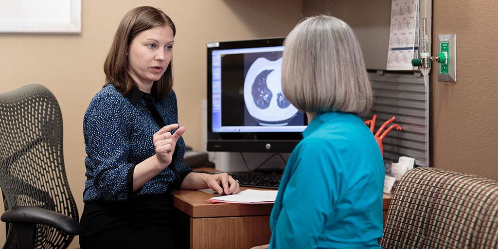 Nurse Practitioner or Physician Assistant Gastroenterology and Hepatology fellow speaks with a patient at Mayo Clinic in Rochester, Minnesota.