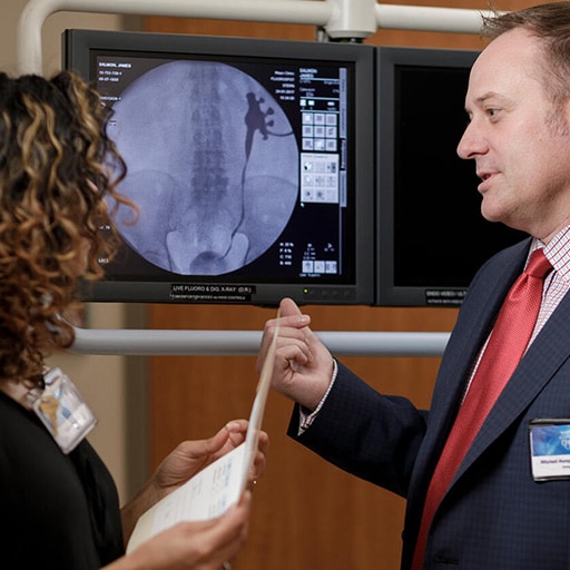 Urology physician and fellow examining an anatomy scan at Mayo Clinic
