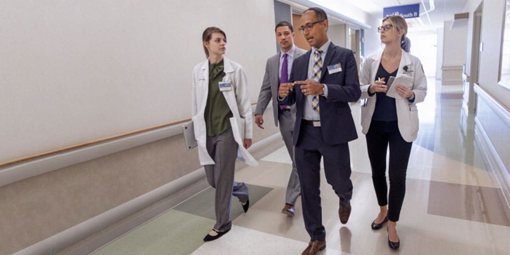 Residents in the PGY-2 Pharmacy Residency in Internal Medicine speak together in the hallway at Mayo Clinic Hospital in Rochester, Minnesota.