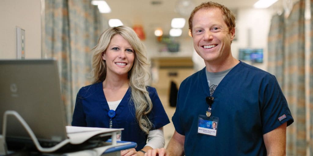 Two Mayo Clinic pharmacists working together in the hallway at Mayo Clinic in Rochester, Minnesota.