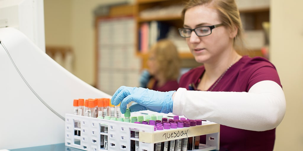 A Mayo Clinic phlebotomist technician working with samples.