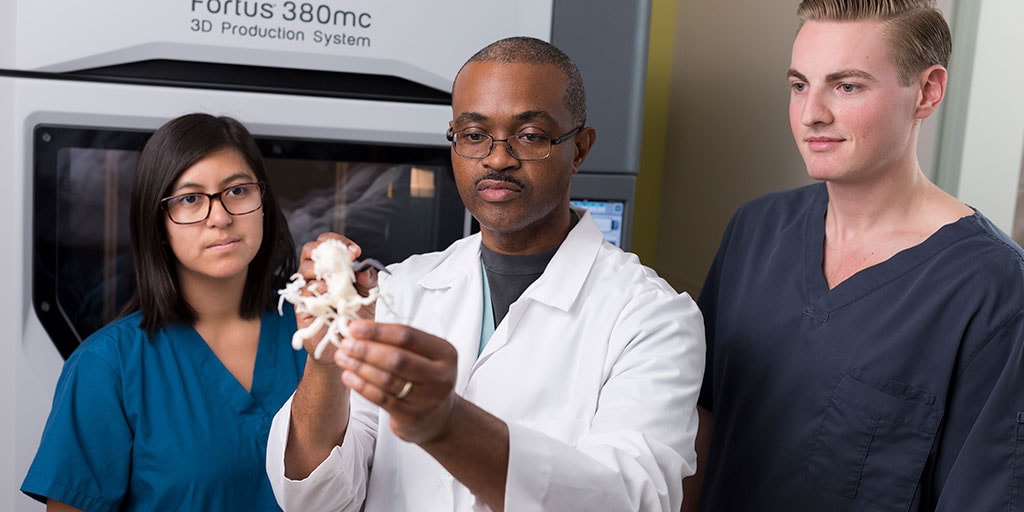Neurosurgery Physician Assistant Fellowship director, Orland K. Boucher, P.A.-C., reviewing with students a newly fabricated 3D model of the circle of Willis in the Precision Neurotherapeutics Laboratory at Mayo Clinic in Phoenix.