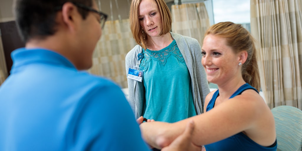 Physical therapy intern working with a patient at Mayo Clinic. 