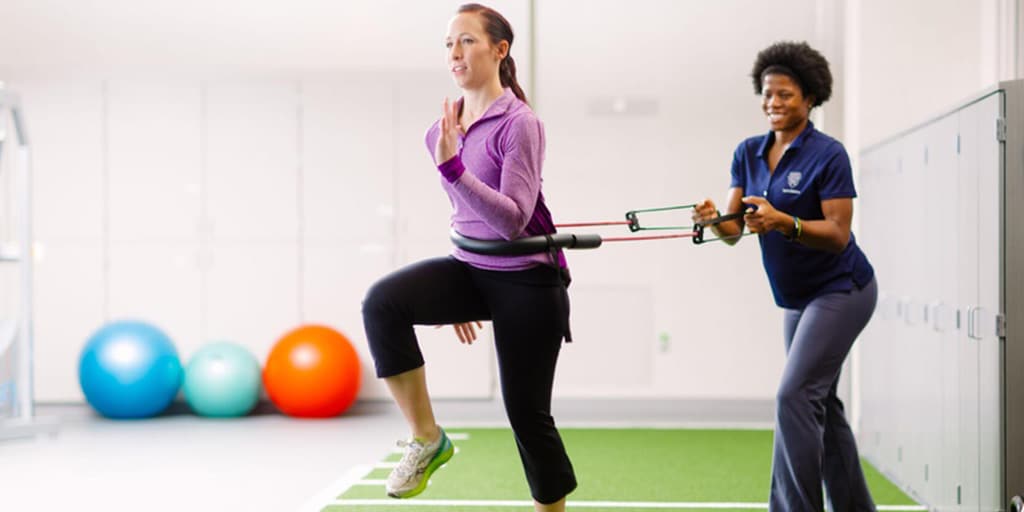 Two PT residents practicing resistance running