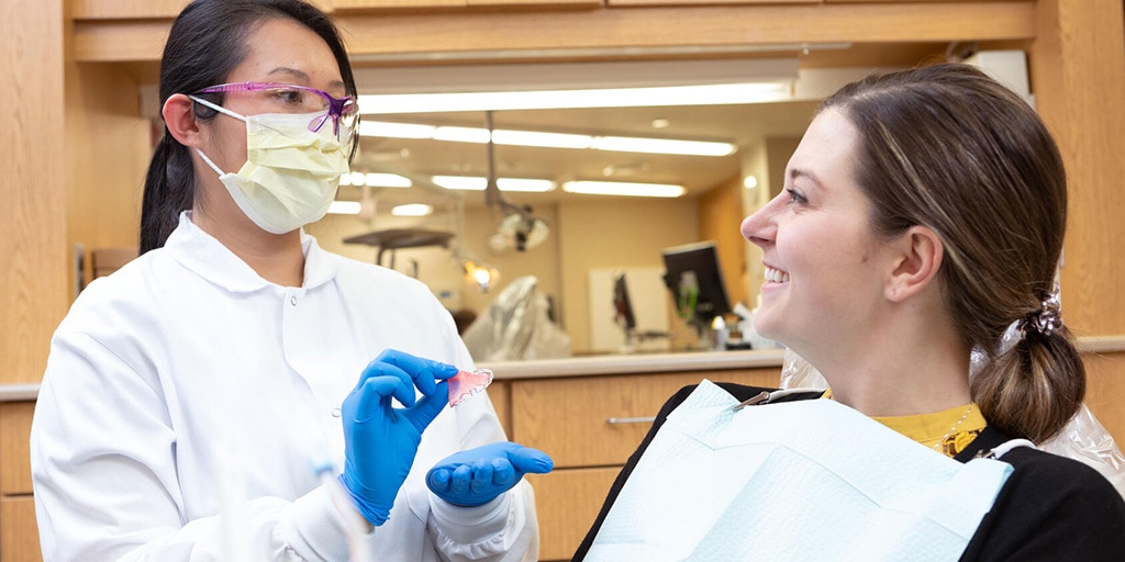 Dental assistant intern works with a dental patient at Mayo Clinic in Rochester, Minnesota