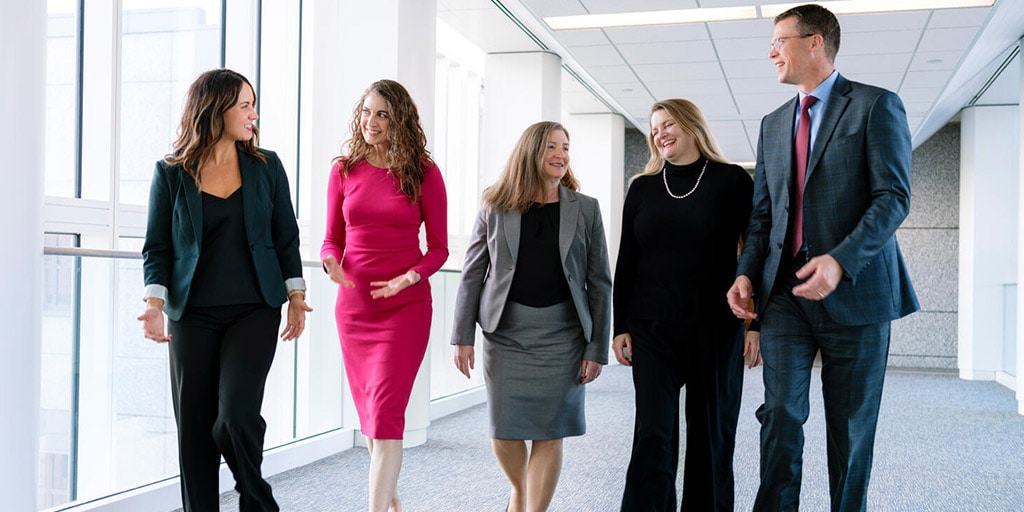 Speech-Language Pathology faculty collaborating as they walk down the hallway at Mayo Clinic in Rochester, Minnesota.