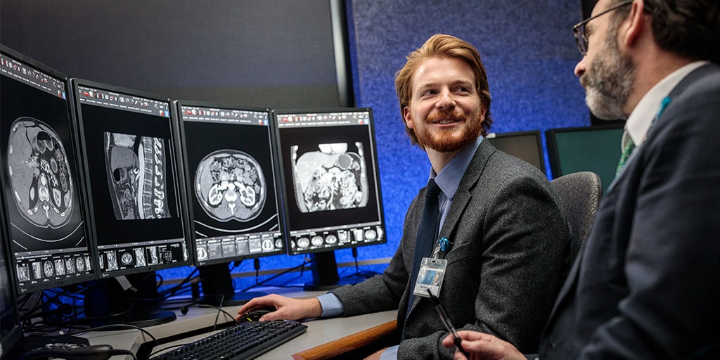 A radiology trainee talks with a faculty member at Mayo Cinic