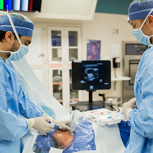 A cardiovascular and thoracic anesthesiologist administers anesthesthetic medicine.