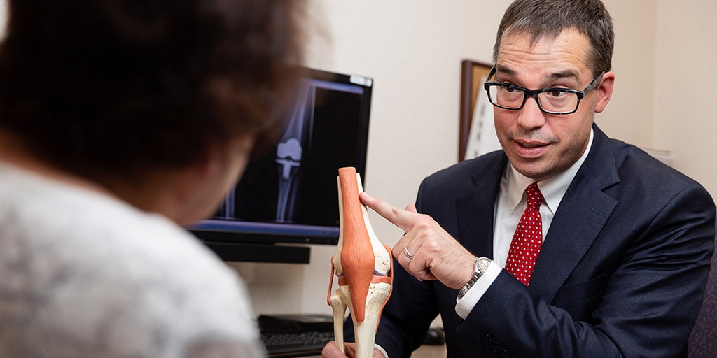 Tad Mabry, M.D., speaks with a patient at Mayo Clinic in Rochester, Minnesota.