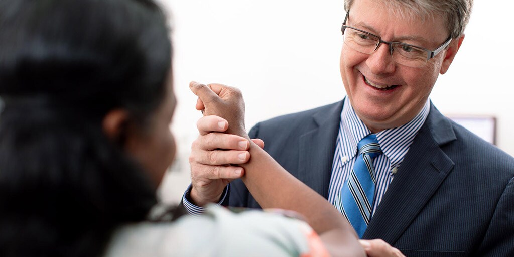 Shawn O'Driscoll, M.D., works with a patient at Mayo Clinic in Rochester, Minnesota.