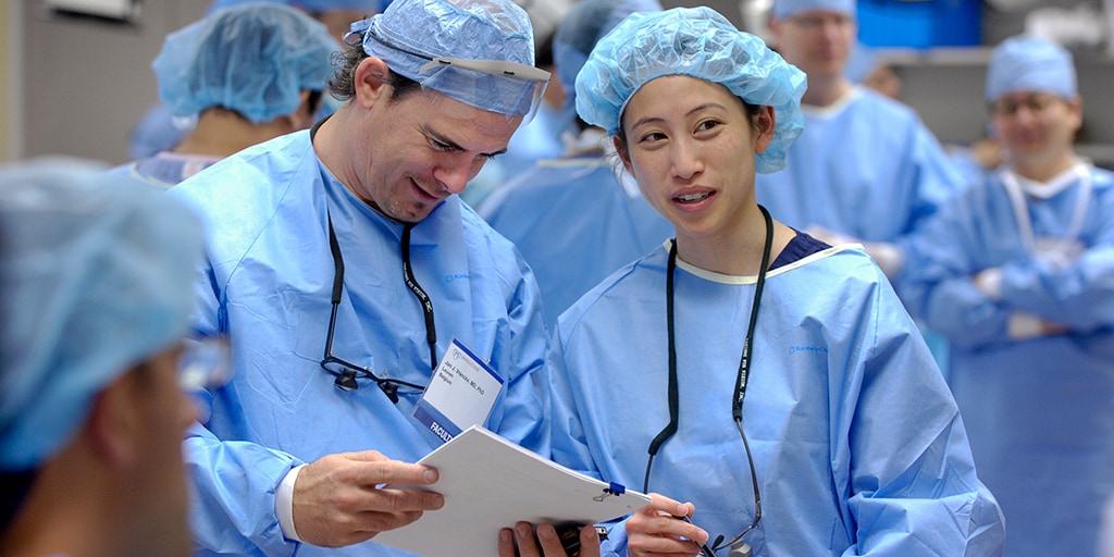 2 adult reconstructive surgeons communicating
