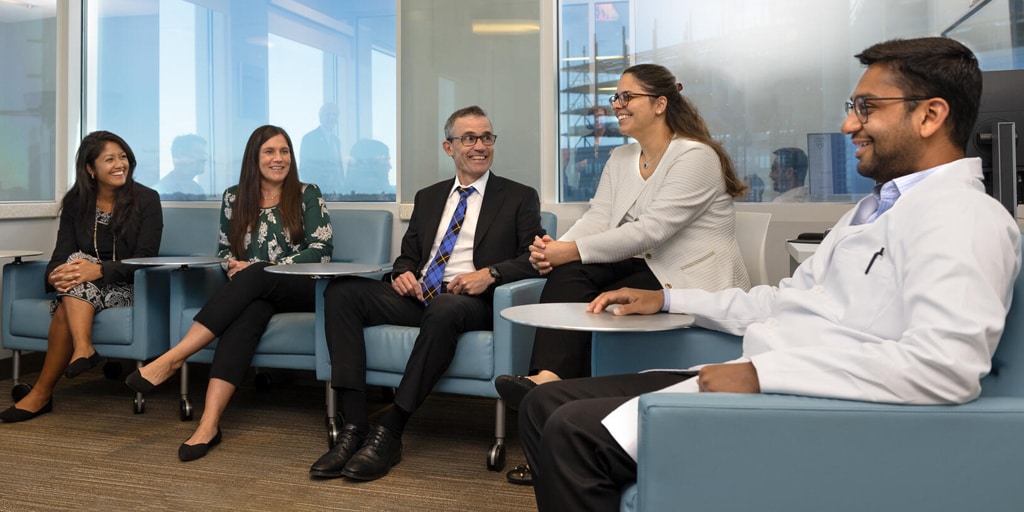 Five people from the Advanced Inflammatory Bowel Disease Fellowship program at Mayo Clinic in Jacksonville, Florida, sat in a conference for a discussion.
