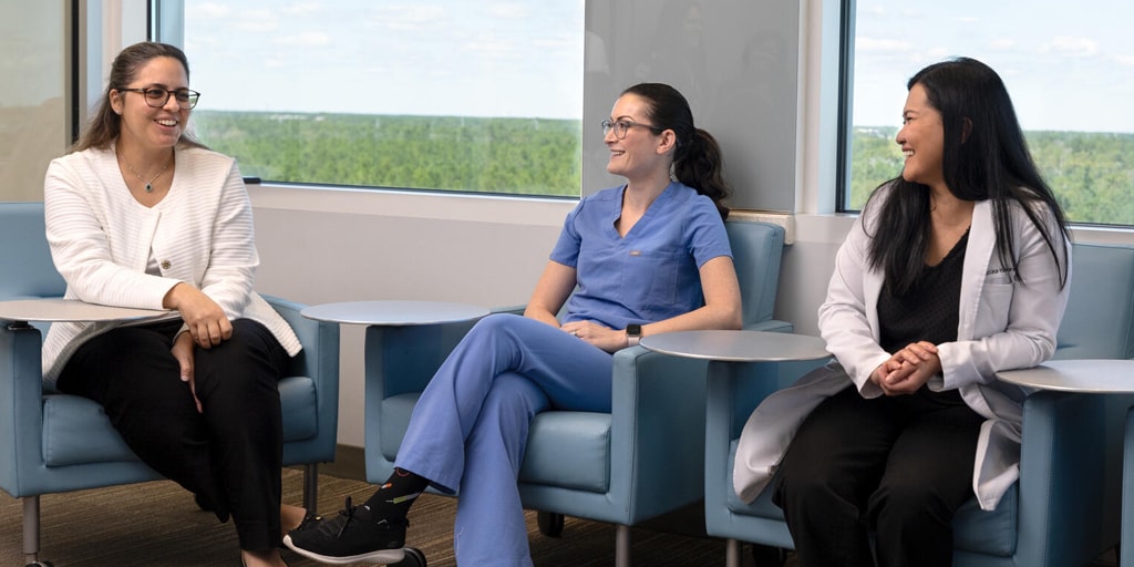 Three people from the Advanced Inflammatory Bowel Disease Fellowship program at Mayo Clinic in Jacksonville, Florida, sat in a conference for a discussion.
