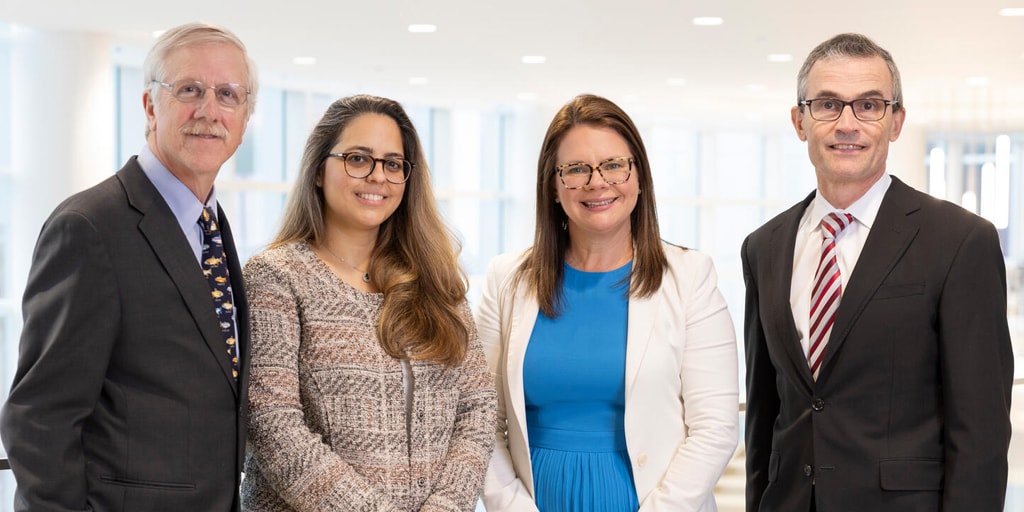 Four members of faculty from the Advanced Inflammatory Bowel Disease Fellowship program at Mayo Clinic in Jacksonville, Florida, posed for a formal group portrait.