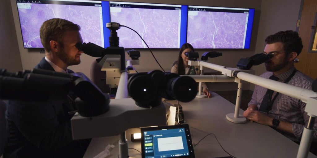 Mayo Clinic anatomic and clinical pathology residents using microscopes