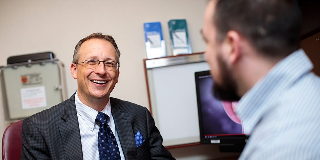 Tobias Kohler, M.D., M.P.H. speaking with a patient at Mayo Clinic in Rochester, Minnesota.