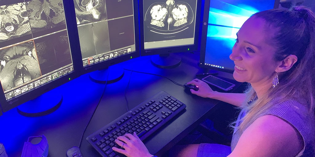 Trainee looking at imaging screens on the computer