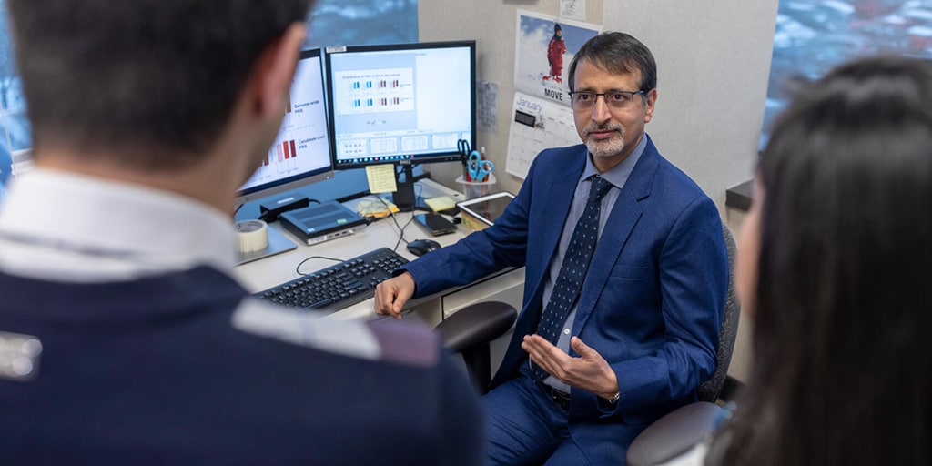 The program director from the Cardiology, Genomics Fellowship in Rochester, Minnesota, at Mayo Clinic School of Graduate Medical Education was in an office and had a discussion with two colleagues.