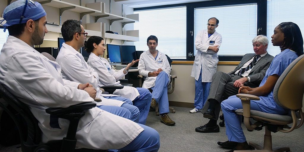 Interventional Fellowship staffers hold discussion