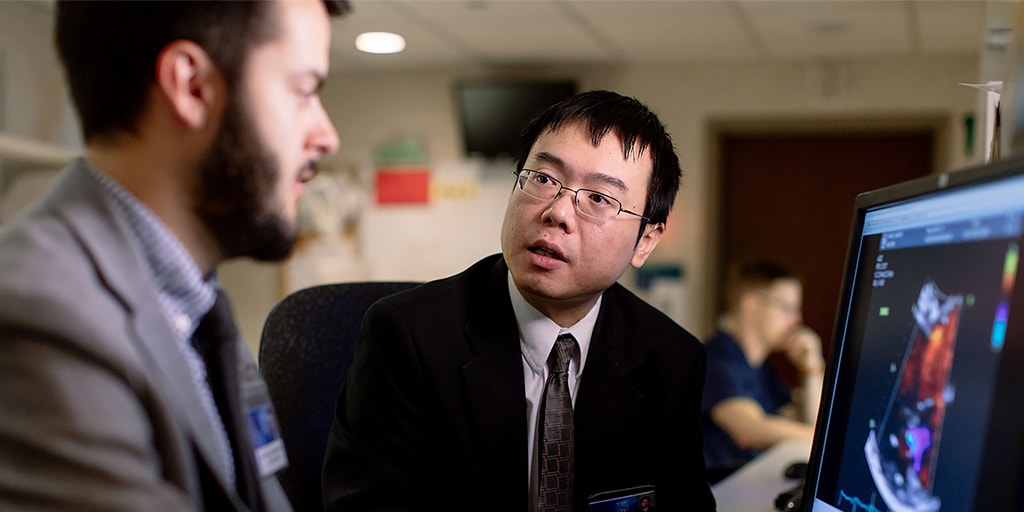 Cardiovascular Diseases fellow discusses a case with a faculty member. 