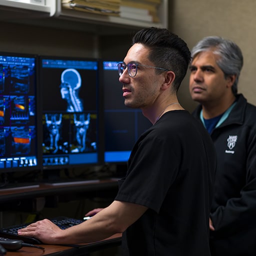 Diagnostic radiology resident looks at scans with a faculty member at Mayo Clinic in Phoenix, Arizona.