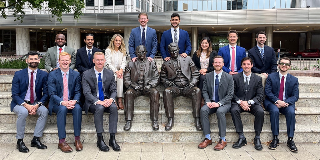 Residents from the Diagnostic Radiology Residency program in Rochester, Minnesota, gather for a group photo with the Mayo brothers' statues.