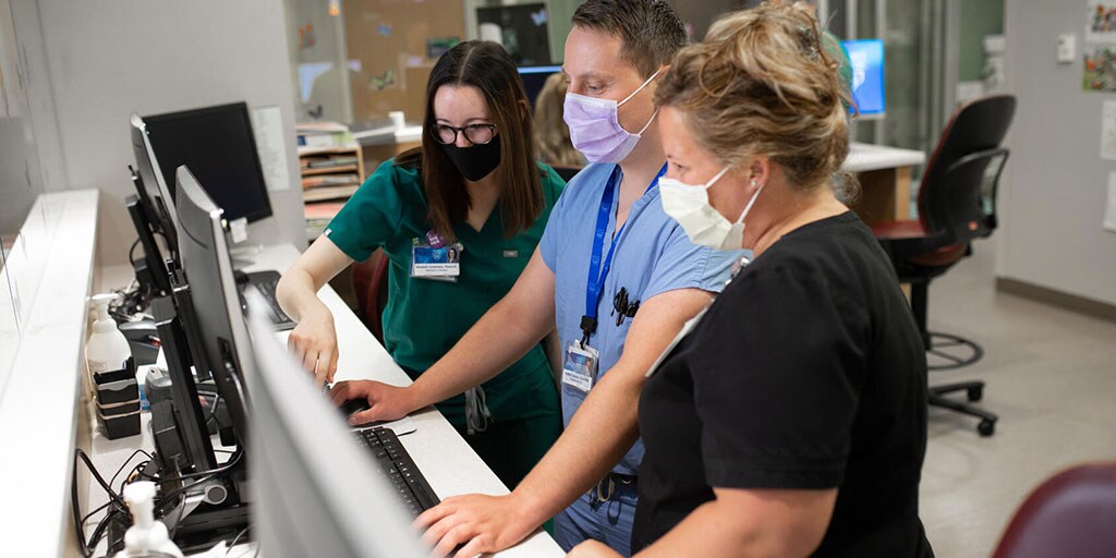 Residents collaborating on the computer