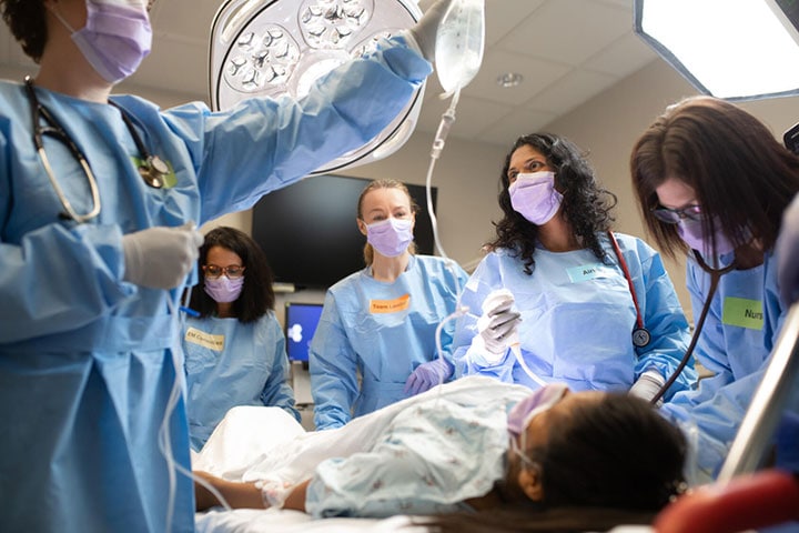 Emergency medicine residents practice in the simulation center