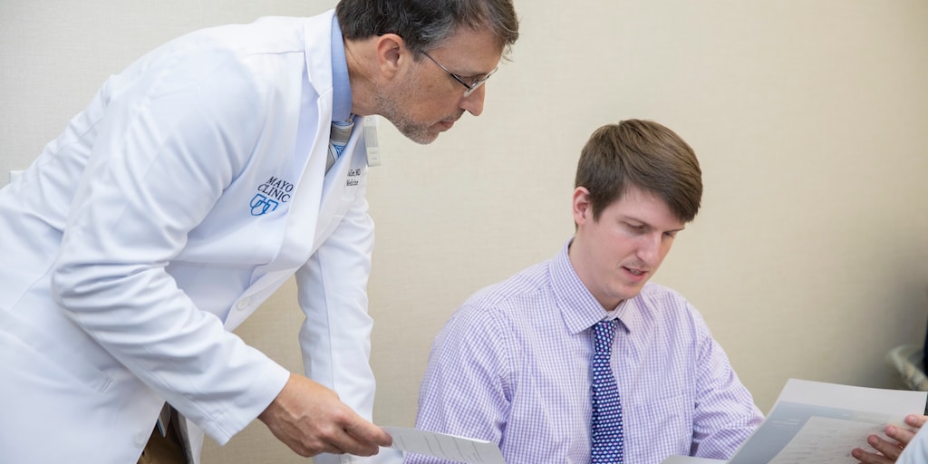 A core faculty member discusses didactic material with a family medicine resident at Mayo Clinic in Jacksonville, Florida.