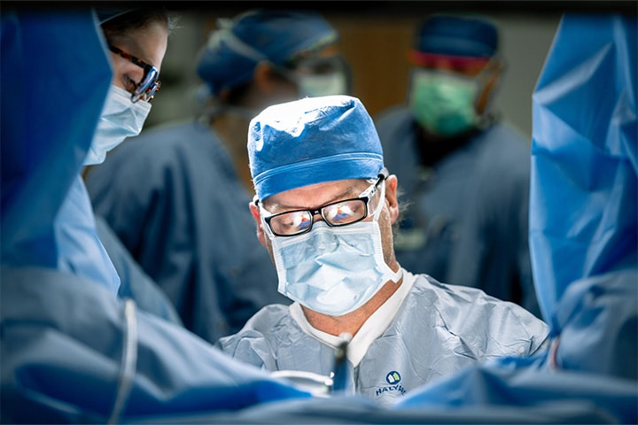 A fellow in the Female Pelvic Medicine and Reconstructive Surgery Fellowship performing a surgery
